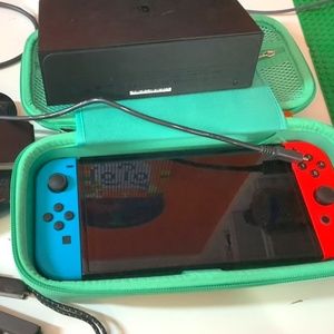 Nintendo Switch OLED BUNDLE (with case 128 gb sd card and its prior accessories)